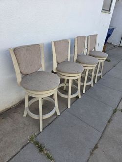 Four White 24" Swivel Counter-Height Stools