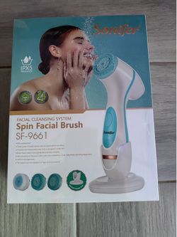 New Sonifer SF-9661 facial cleansing system has a white and blue waterproof body. This set includes three types of replacement brush heads: a sensitiv