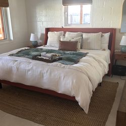 Fabric rust colored king size bed with mattress