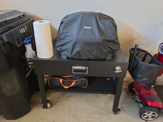Ninja Grill, Smoker,Air Fryer,  Roaster, Broiler, Bake all in one, with roll away cooking table, grilling utensils rack, hangers, paper towels holder,
