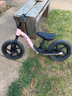 CHILD'S KRIDDO BIKE; cross streets are Arapaho & Waterview