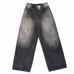 Acne Studios black wide leg jeans with paint splatter