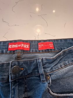 Ring of Fire slim-fit jeans in size 34W × 30L