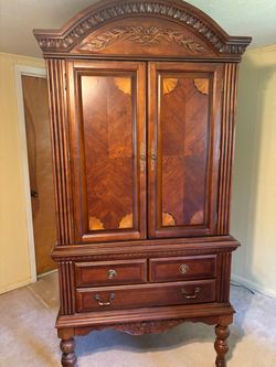 Large Wood Armoire with Carved Details