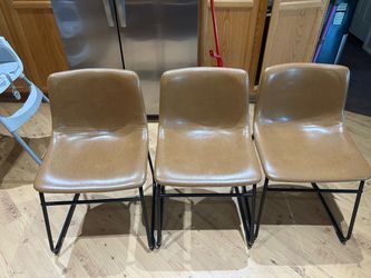 Camel Brown Leather Dinning room chairs with black rod iron legs