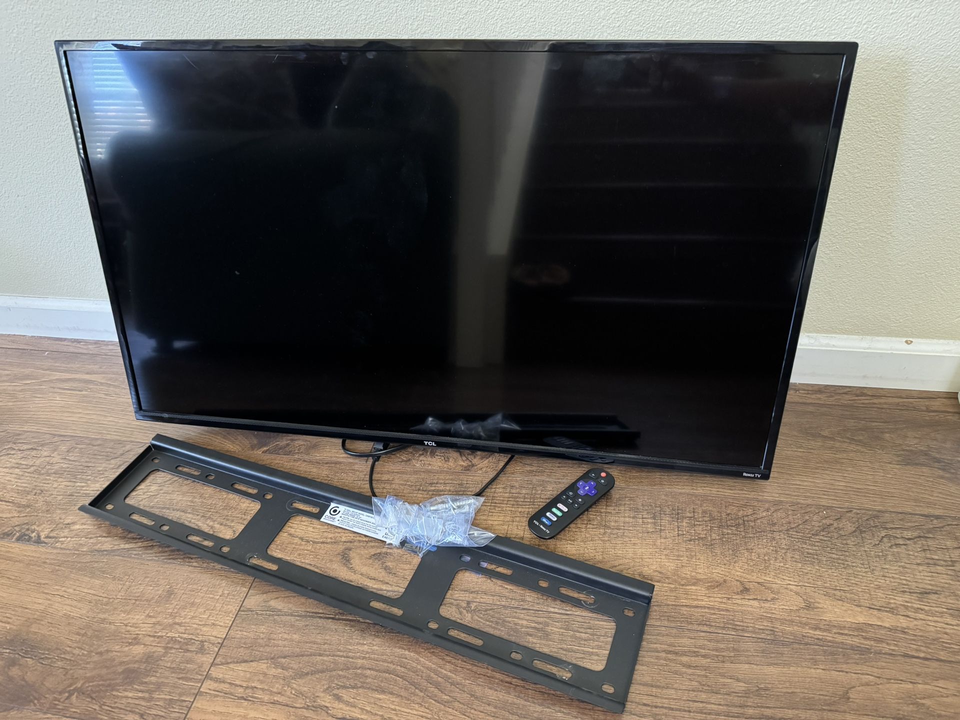 TCL 40” Roku TV with Remote and Wall Mount/Base
