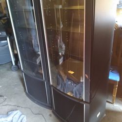 Entertainment Cabinet 64 " In height 22" Wide 18" in Depth.It has lights that Work and three glass shelves. $60 for both!