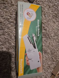 Never-used Handy Stitch portable sewing machine