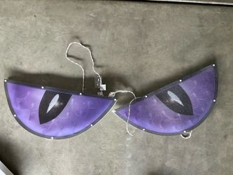Purple eye spooky window silhouettes