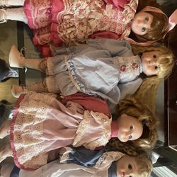 Lot Of 4 Porcelain Dolls