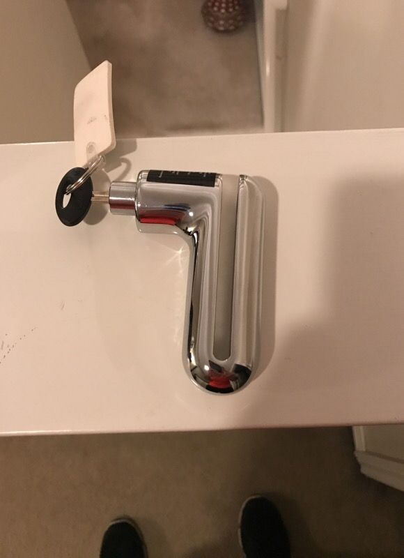 Motorcycle lock fits on front disc