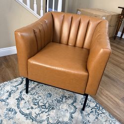 27.5” wide faux light brown leather chair (new w/ minor defects)