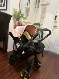 Pink doona stroller
