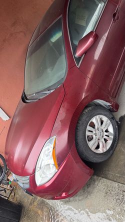 2011 red/ burgundy nissan altima