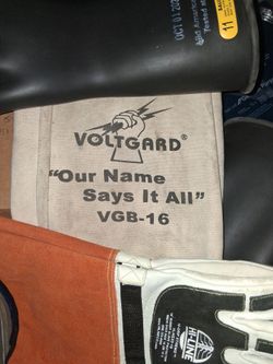 Voltgard, electricity insulator gloves.