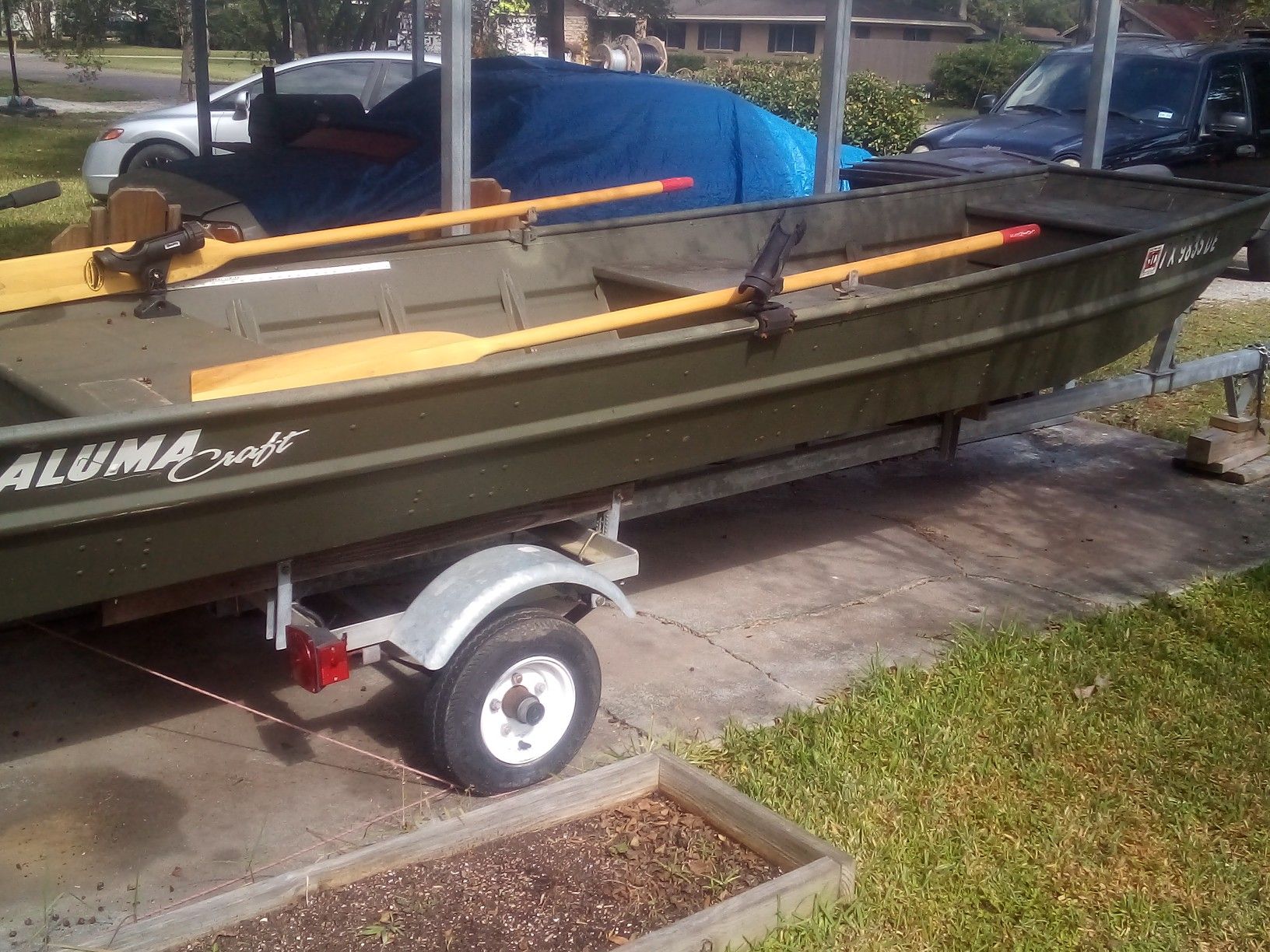 14 ft aluminum boat with 5hp Colman 4 stroke outboard motor with trailer