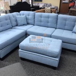 Brand new light blue linen sectional sofa with Ottoman and 2 accent pillows