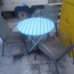 Table And Three Chairs