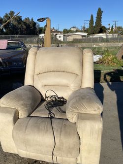 Free Very Comfy reclining chair with foot rest, and USB charger!