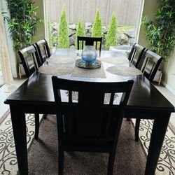 Wooden Dining Table With Leather Seated Chairs 