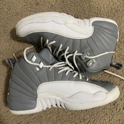 Youth Nike Air Jordan 12 Retro "Stealth" sneaker in the grey and white colorway