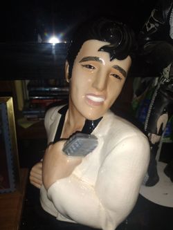 I have these three Elvis collectibles one of the Elvis bust the other the Elvis doll the other one is a Elvis stamp not real-time glass temp for the p