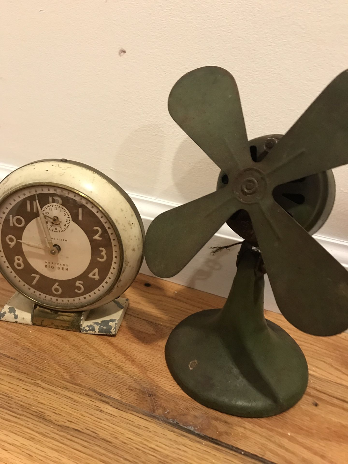 Antique metal fan and clock