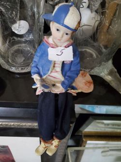 Ceramic Boy With Game Legs Dangle Decor