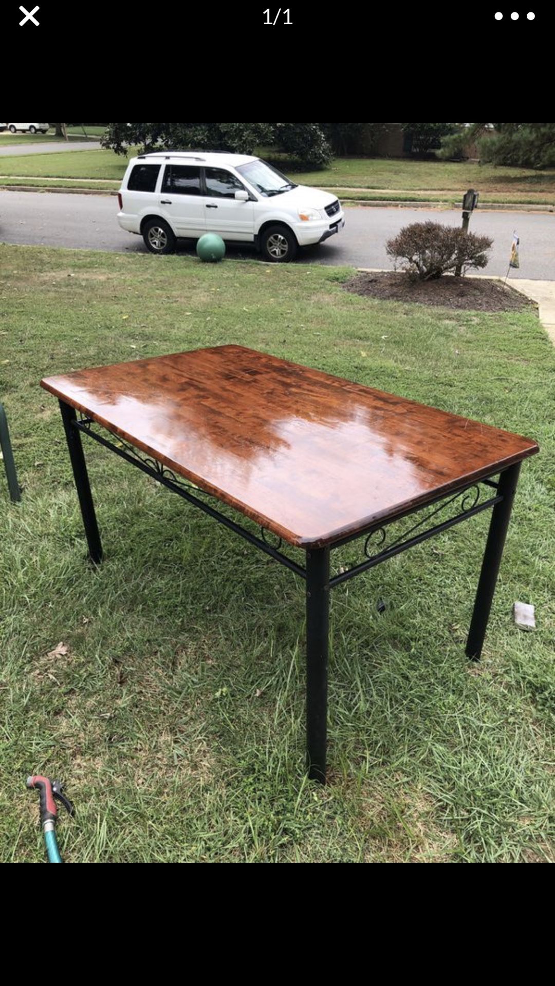 Beautiful wooden table with black iron base