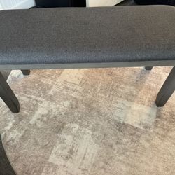 Gray upholstered dining bench 