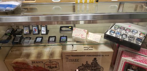 Zippo lighters $20 NFL watches $20 ea Bulldog Mack fire engines $95 each with boxes