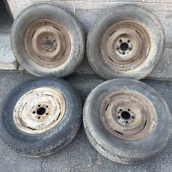 Four 15 inch steelies from a ford car 5 on 4.5 steel rims 
