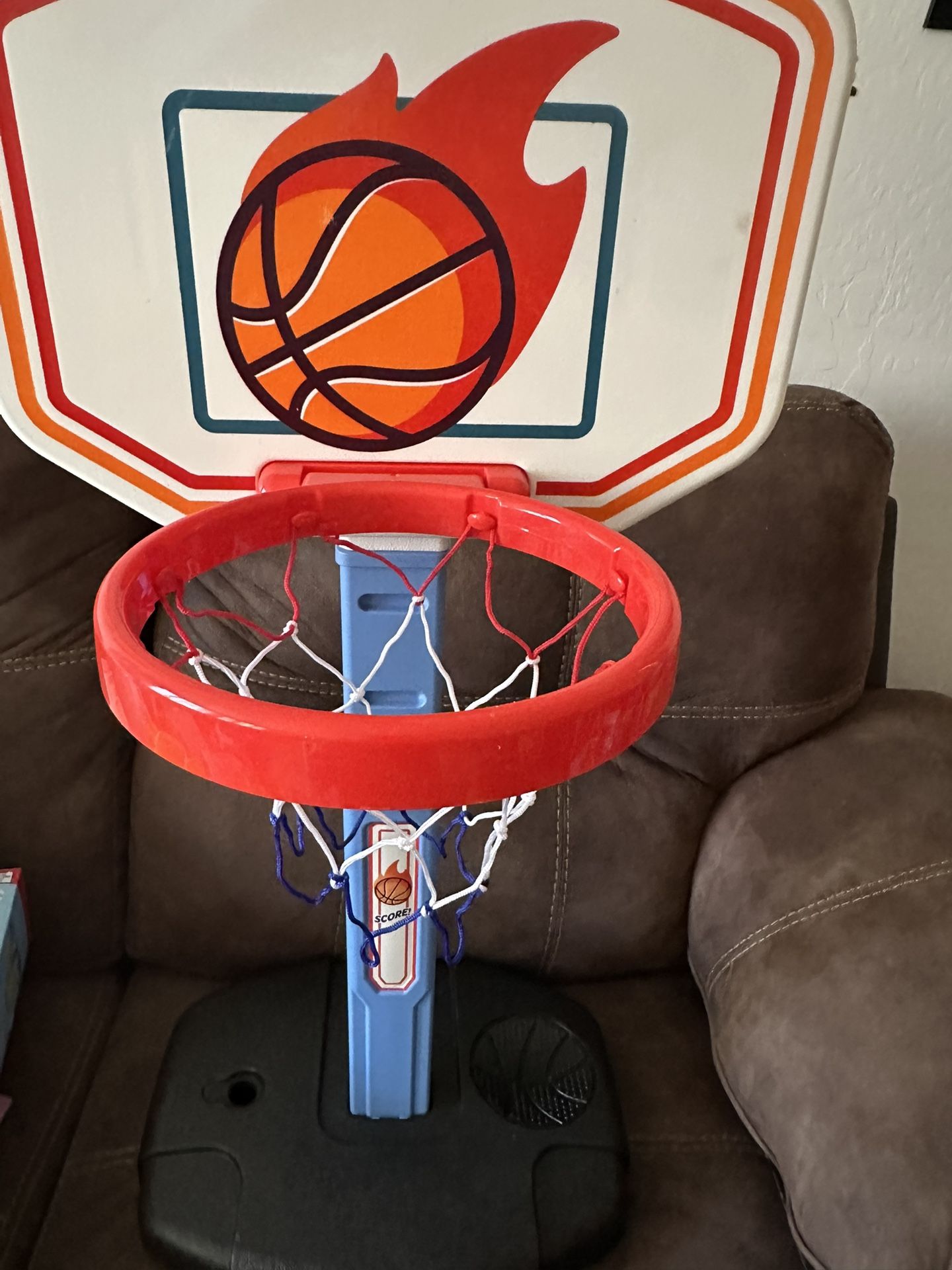 Baby adjustable size basketball hoop Open box item never used but missing 2 screws and cover for little hole. Comes with pump and 1 ball