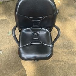 suspension seat for a lawn mower, tractor, skid steer, or forklift