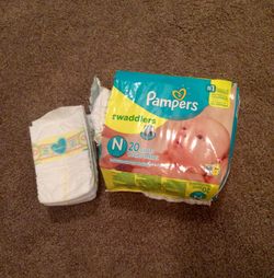 Pampers swaddlers (23 diapers)