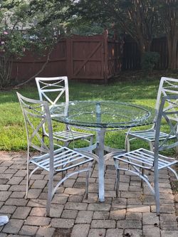 White glasstop table w 4 chairs
