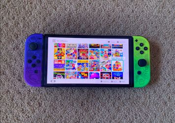 Nintendo Switch OLED + 100 SWITCH GAMES and 7000 RETRO Games