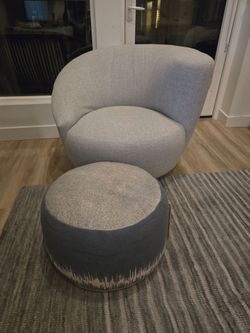 Unique accent swivel chair and ottoman