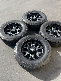 8x180 Hostile Rage 22” Wheels with 37” Toyo Tires Made for 8 lug GMC Sierra and Chevy Silverado 2500 and 3500