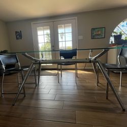 Glass Dining Table With Chrome Base And Chairs