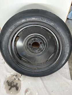 Spare tire for 2000 jeep Cherokee with original grey cover