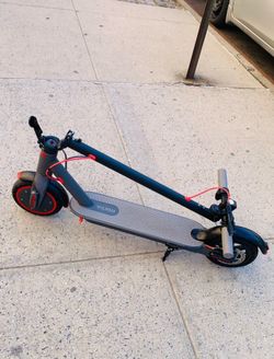 Volpam electric scooter. Gray and black with red accents. Lightweight for carry bus train 🚂 and run fast 25mph cruise control system rubber tires nev
