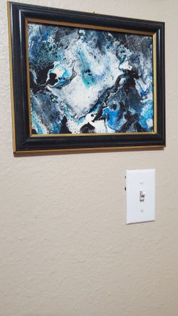 Black / gold framed blue/black acrylic pour painting