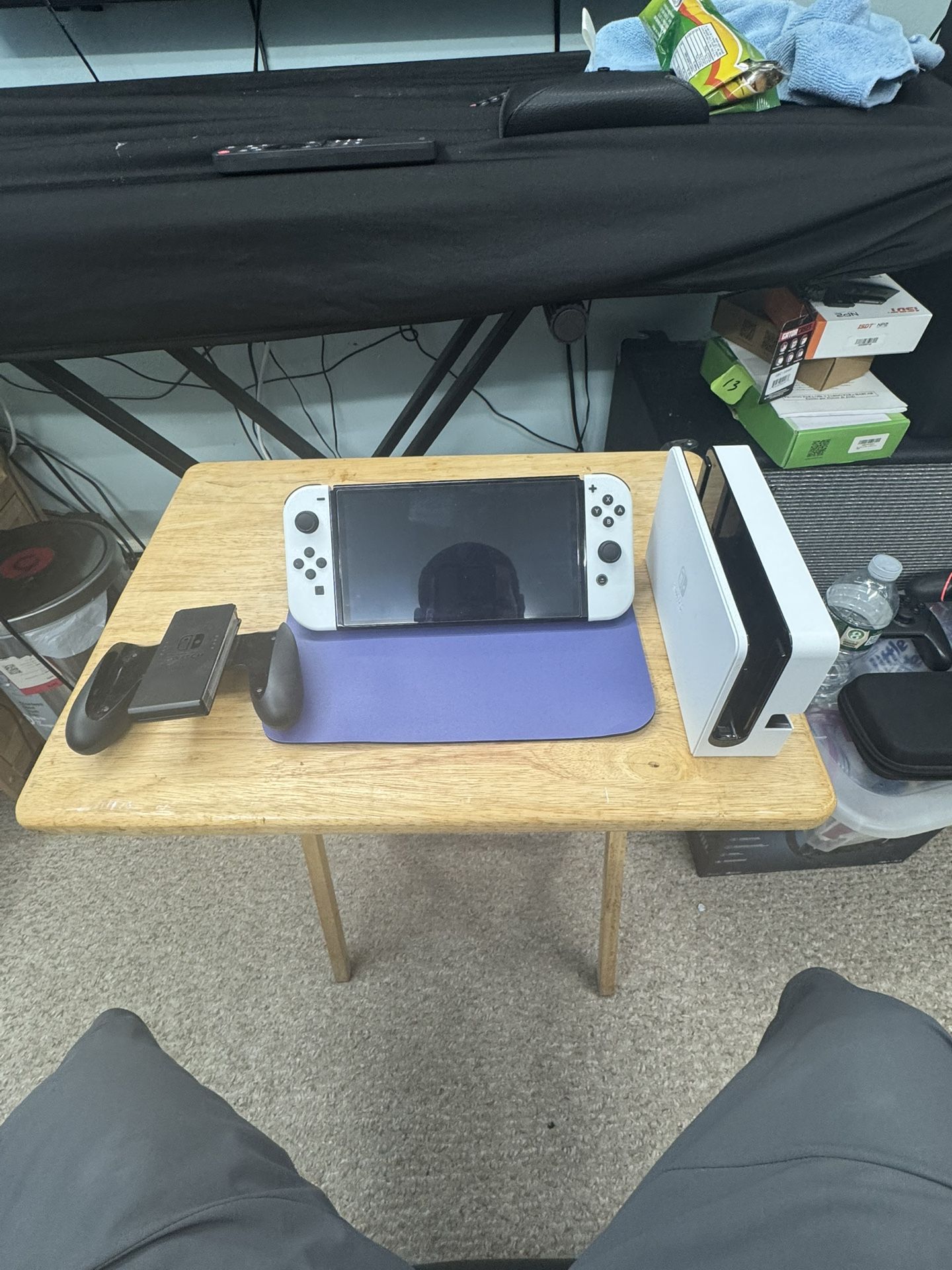 Nintendo switch OLED with joy con + 5 games and two additional controllers, docking station, and a protective carrying case