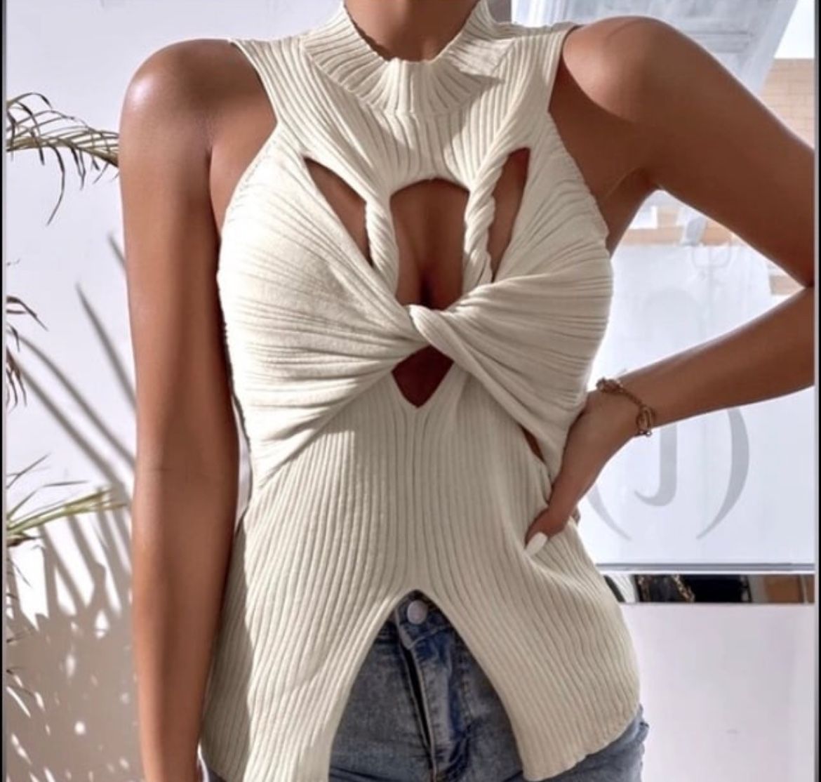 NWT, Lavishly Paris Cut Out Twisted Front Slit Hem Sweater.