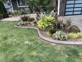 Landscape Curbing Decorative Between Grass And Flowerbeds 