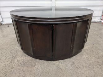 Circular Dark Wood Coffee Table with Paneled Sides