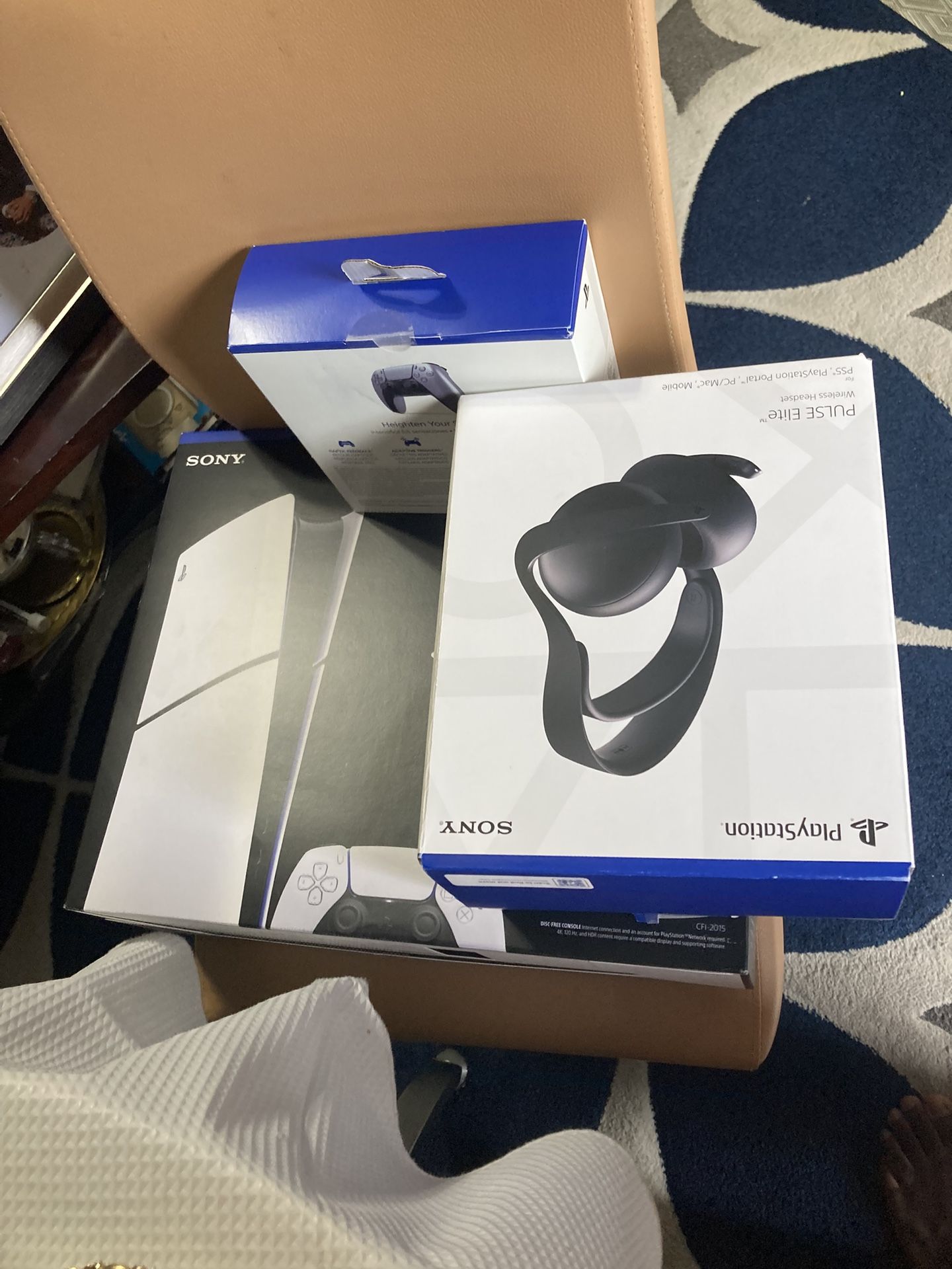 PS five and a controller and headphones