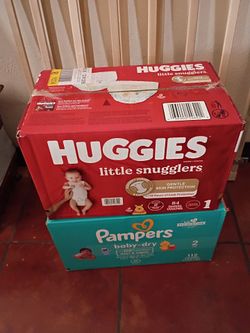 Pañales 28 dólares la caja roja $30 la caja azul cantidad y talla la fotografía firme precio