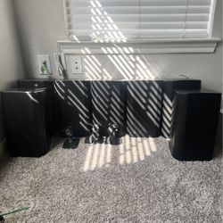 7 QSC AD-S6T Surface Mount Speakers and 1 QSC RMX850A Amplifier